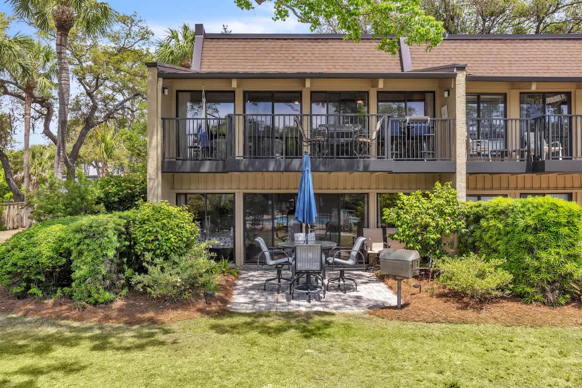 Private Patio Overlooking Community Pool with Charcoal Grill and Beach Path