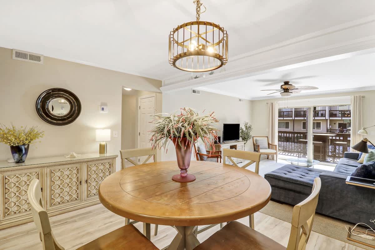 Your elegant dining space flows seamlessly into the living area, featuring a beautiful round table perfect for shared meals and memorable conversations.