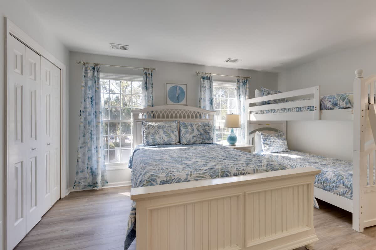 Sleep peacefully in your coastal-themed bedroom featuring a cozy bunk bed and queen bed, perfect for families or friends traveling together.