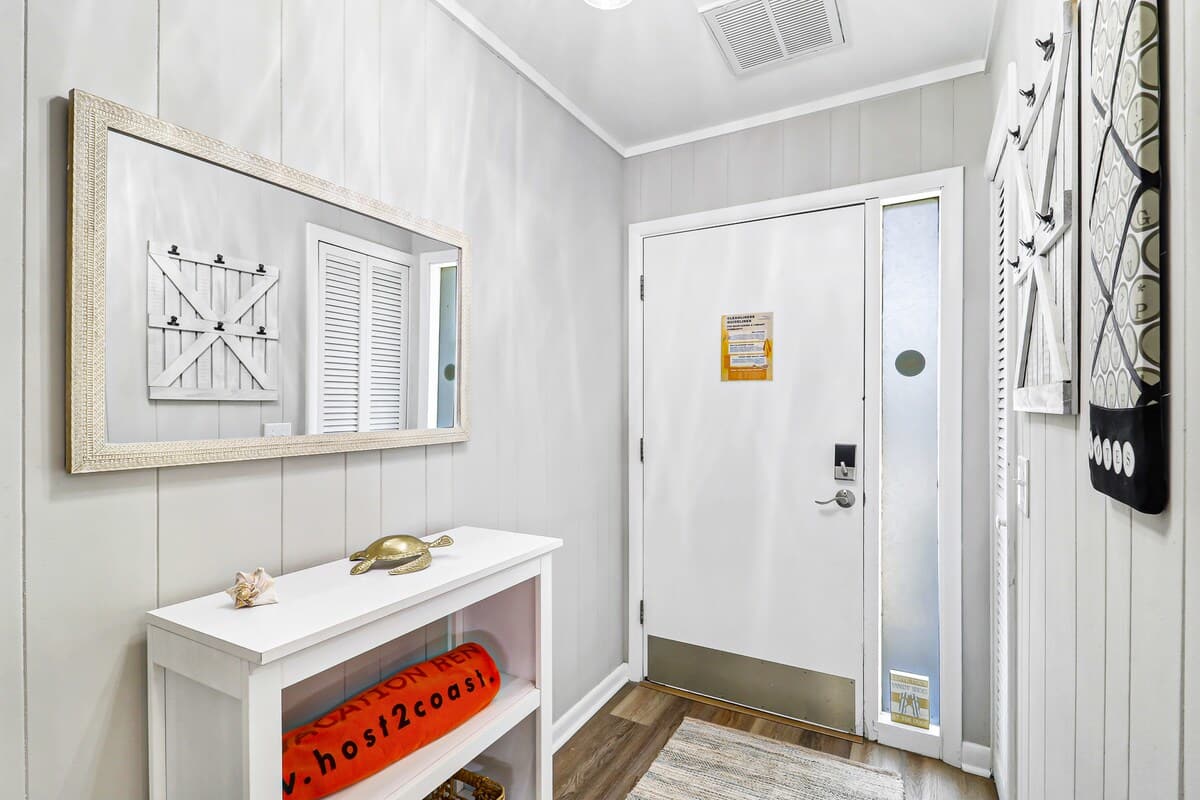 Step into your bright, welcoming entryway where coastal charm meets comfort—your perfect home base awaits.
