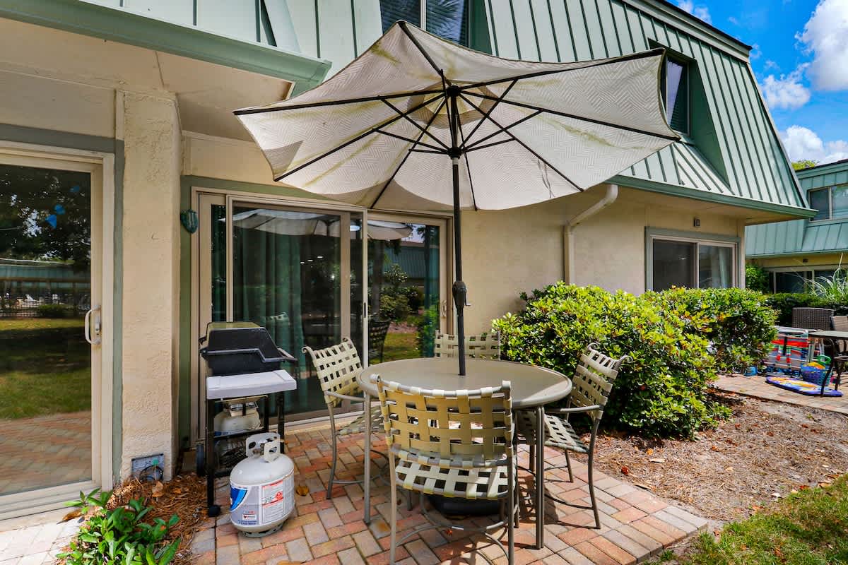 Step onto your private patio where outdoor dining awaits under shade, with BBQ ready for memorable meals in the fresh air.