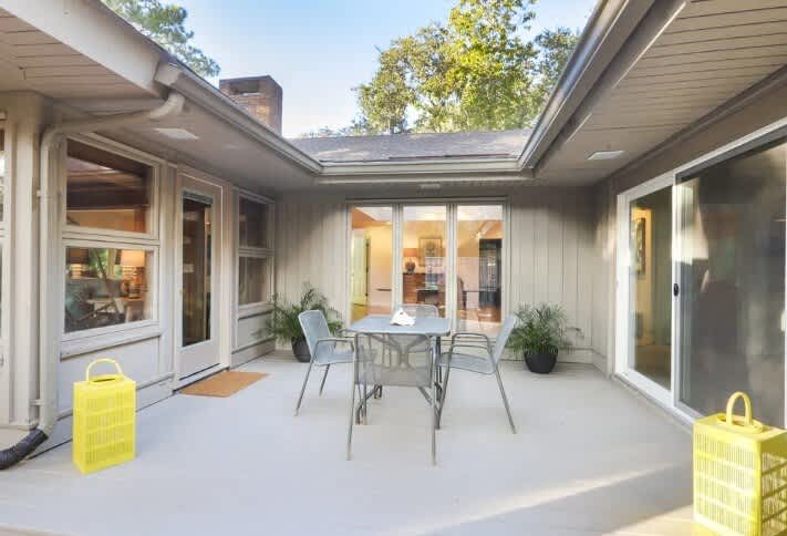Right off the kitchen, perfect for morning coffee, dining, and grilling