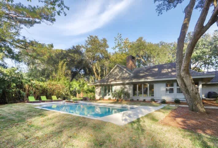 Private backyard with mature trees for shade and privacy