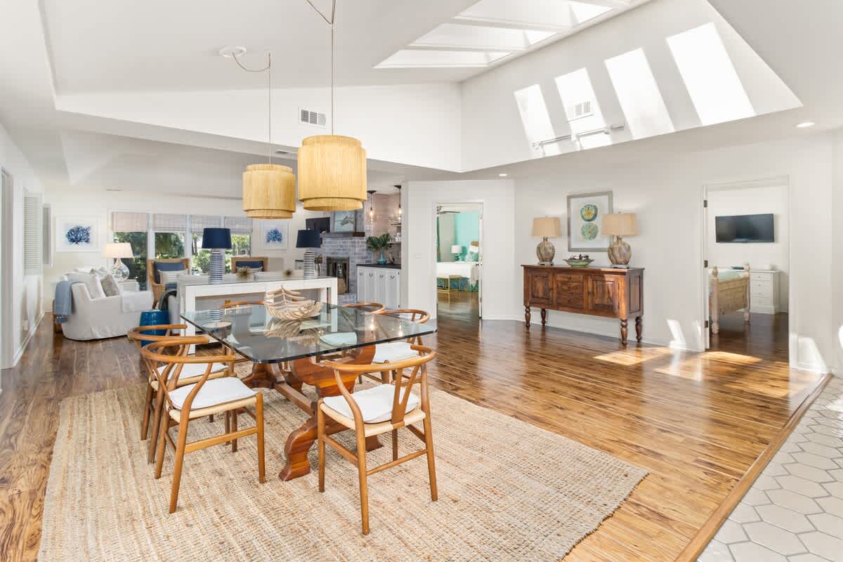 Open layout connecting living, dining, and pool views