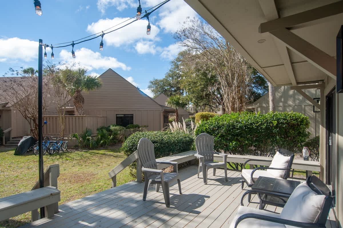 Your private deck offers comfortable seating and string lights for magical evening gatherings.