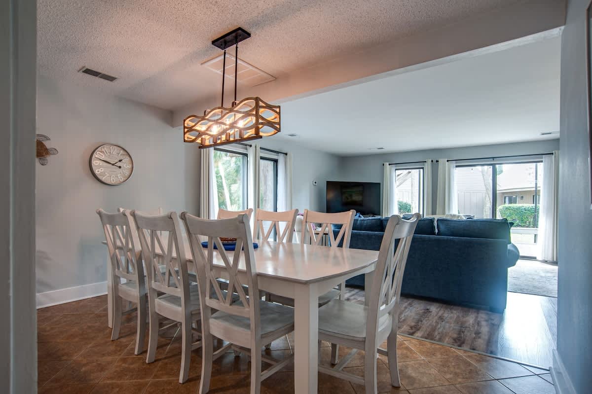 Share memorable meals at your spacious dining table while natural light streams through large windows overlooking the peaceful neighborhood.