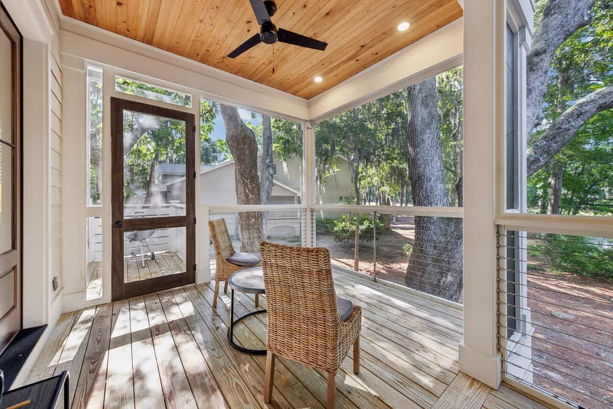 Screened Wraparound Porch with Views of Lagoon, Private Pool, and Glimpses of Golf Course