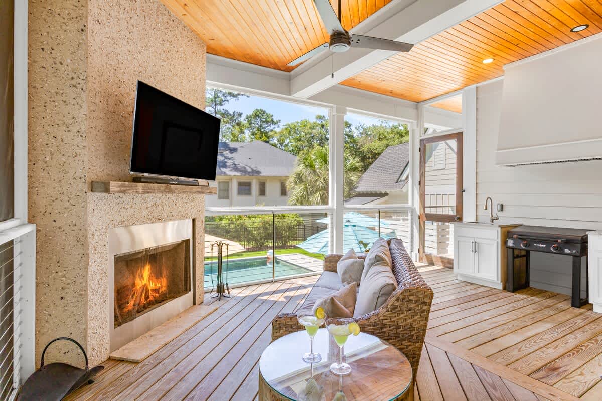 Screened Wraparound Porch with Views of Lagoon, Private Pool, and Glimpses of Golf Course