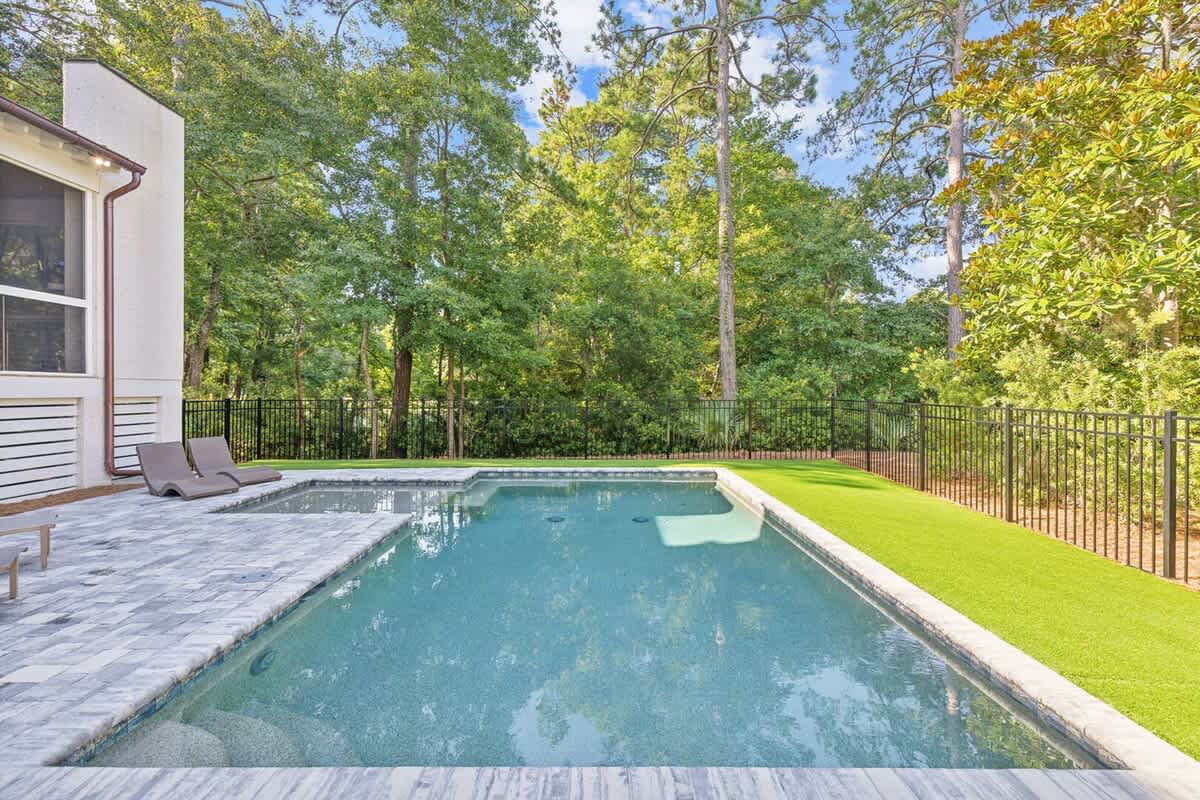 Private Pool with Secure Fenced Yard and Lush Astroturf
