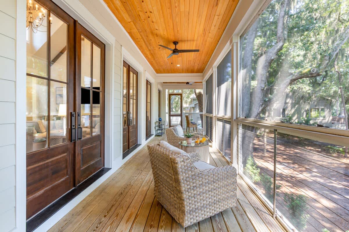 Screened Wraparound Porch with Views of Lagoon, Private Pool, and Glimpses of Golf Course