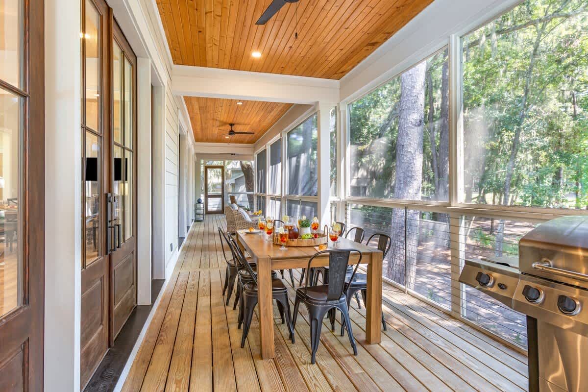 Screened Wraparound Porch with Views of Lagoon, Private Pool, and Glimpses of Golf Course