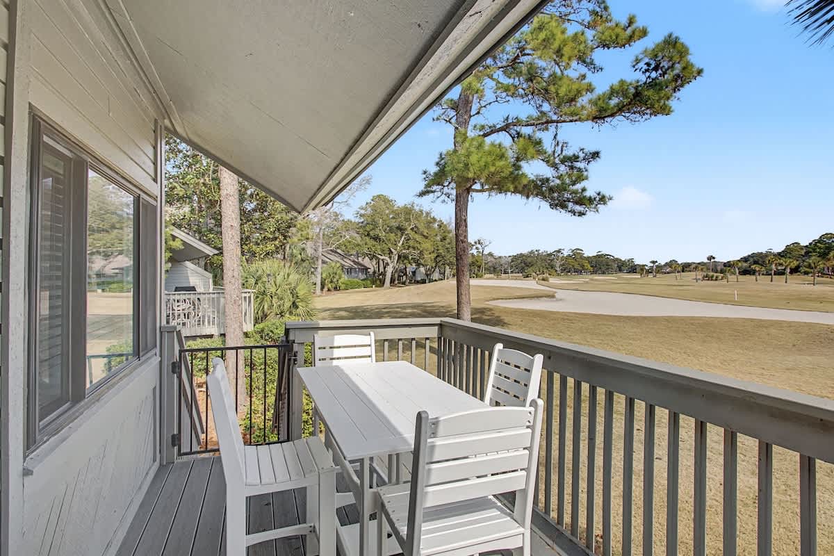 Step onto your private balcony to enjoy morning coffee with panoramic golf course views stretching beyond towering pines.