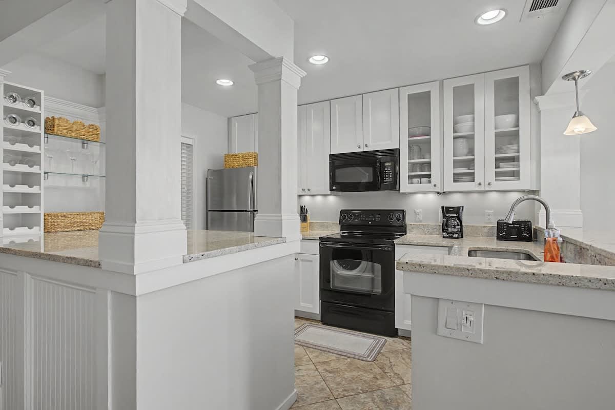 Your fully-equipped kitchen awaits with granite counters, stainless appliances, and abundant storage for creating memorable meals together.