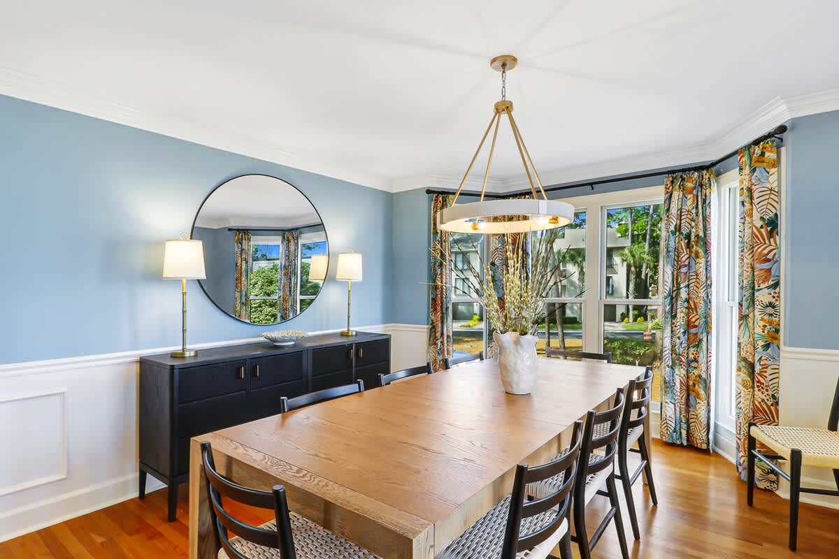 Gather around this beautiful dining table where memorable meals await in your elegant, sunlit space.