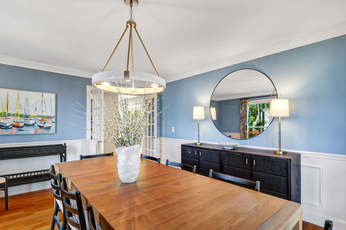Gather around your elegant dining table where coastal charm meets sophisticated style in calming blue tones.