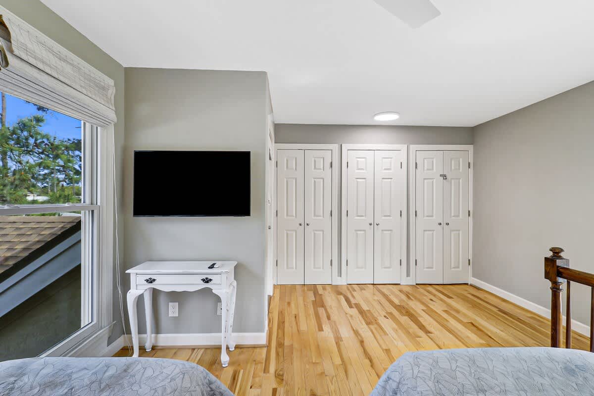 Relax in your serene bedroom with warm hardwood floors, wall-mounted TV, and plenty of closet space for all your belongings.
