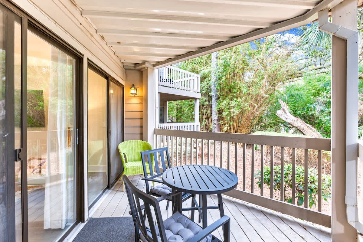 Step onto your private balcony and breathe in the fresh forest air while enjoying morning coffee at your outdoor dining table.
