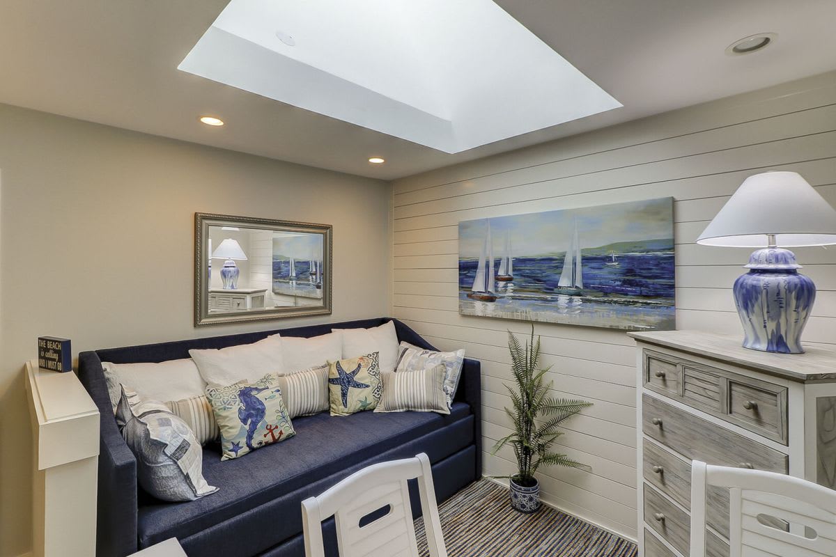 A bonus upstairs loft area adds to the charm, featuring a trundle twin bed and a cozy sitting area.