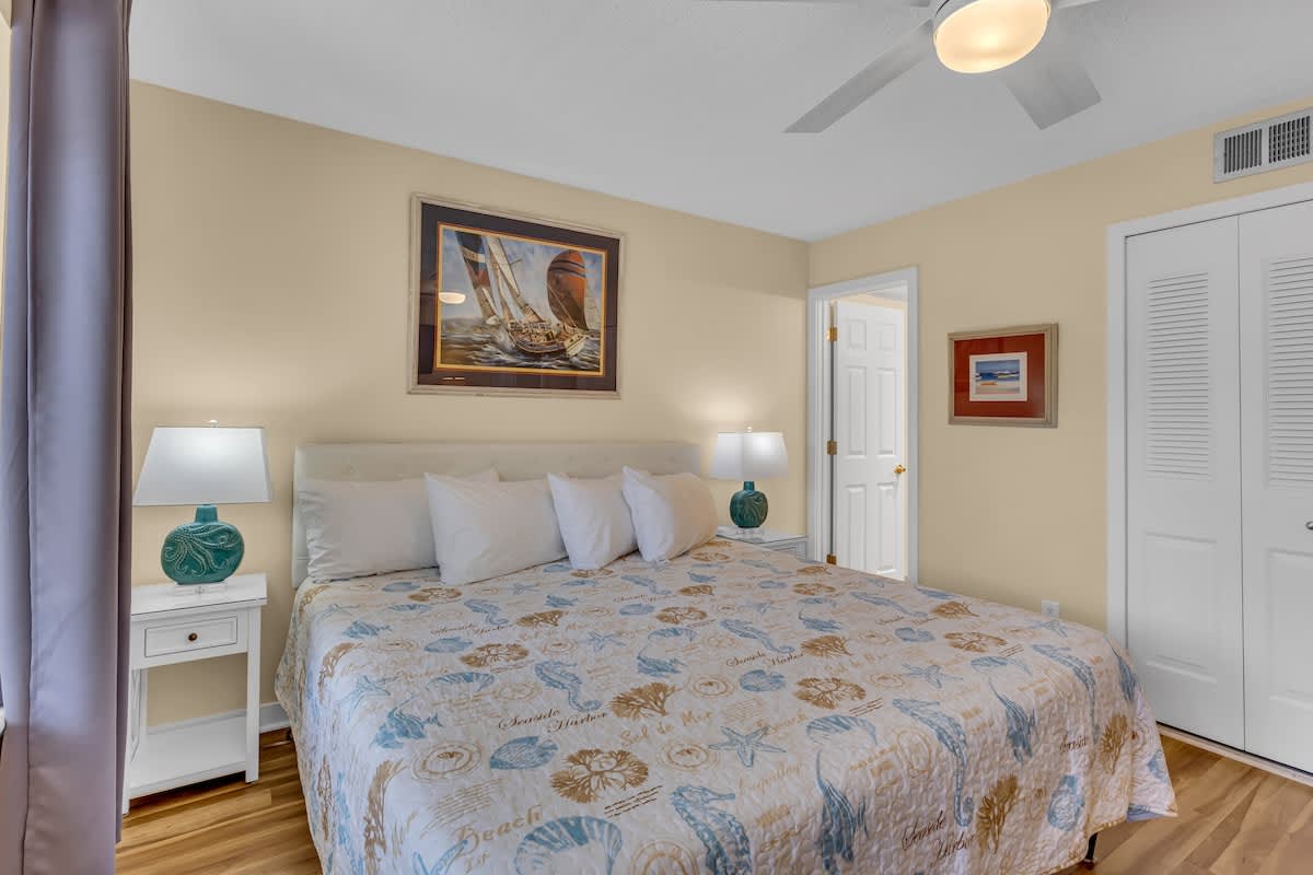 Drift off in your coastal-themed bedroom with soft linens, nautical artwork, and gentle ceiling fan keeping you comfortable all night.