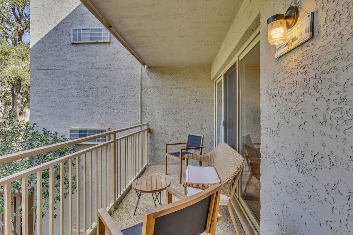 Step onto your private balcony where morning coffee feels perfect among stylish furnishings and peaceful surroundings.