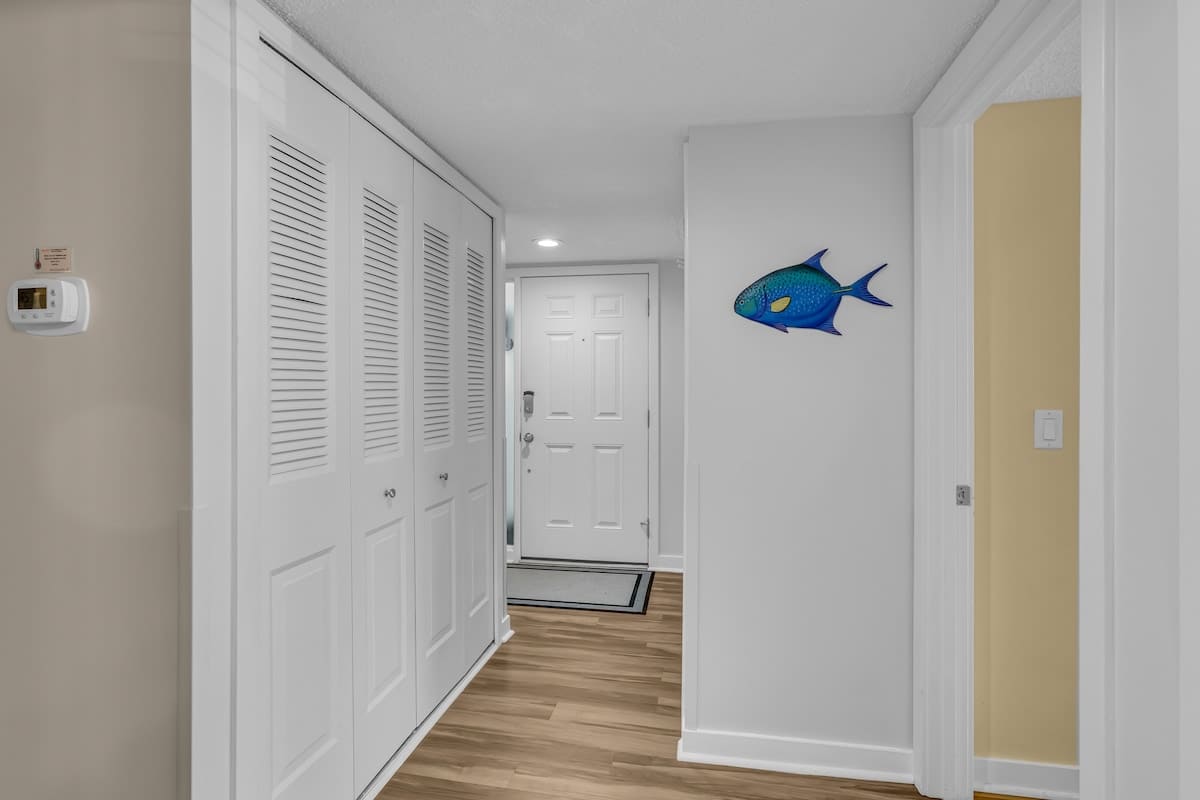 Step into your coastal retreat with nautical charm welcoming you home. The bright hallway features convenient storage for all your belongings.