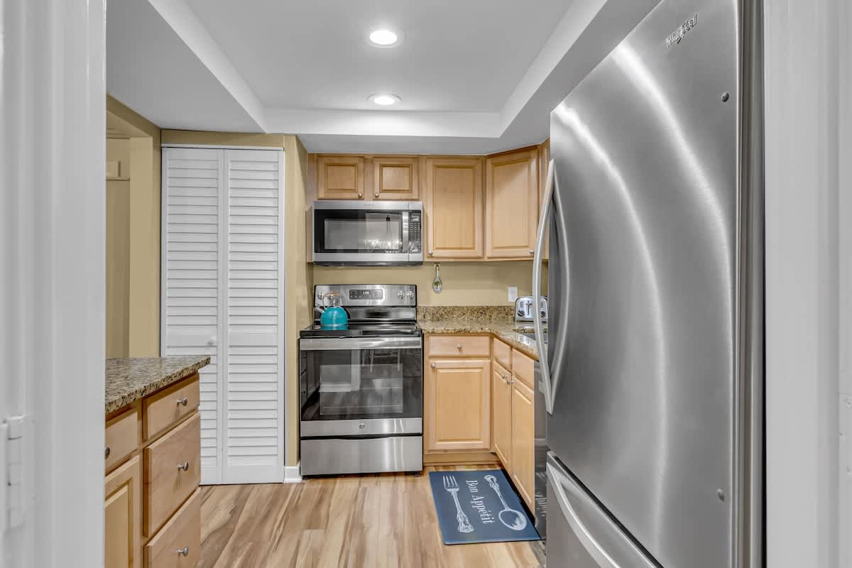 Your fully equipped kitchen invites culinary adventures with granite counters, stainless appliances, and everything needed for memorable meals.