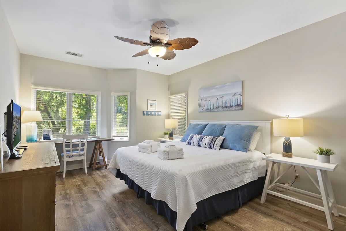 Relax in your peaceful bedroom with soft linens, natural light, and charming coastal touches for the perfect retreat.