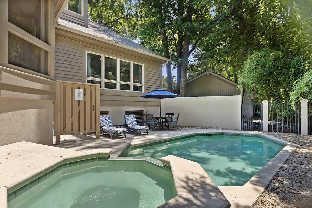 Relax by your private pool with spa, surrounded by mature trees for complete privacy and tranquility.