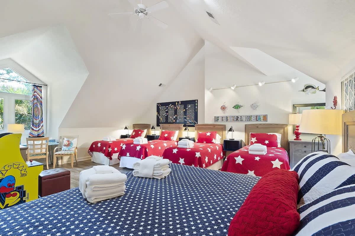 Your spacious family room features cheerful star-patterned bedding and vaulted ceilings, perfect for creating magical memories with loved ones.