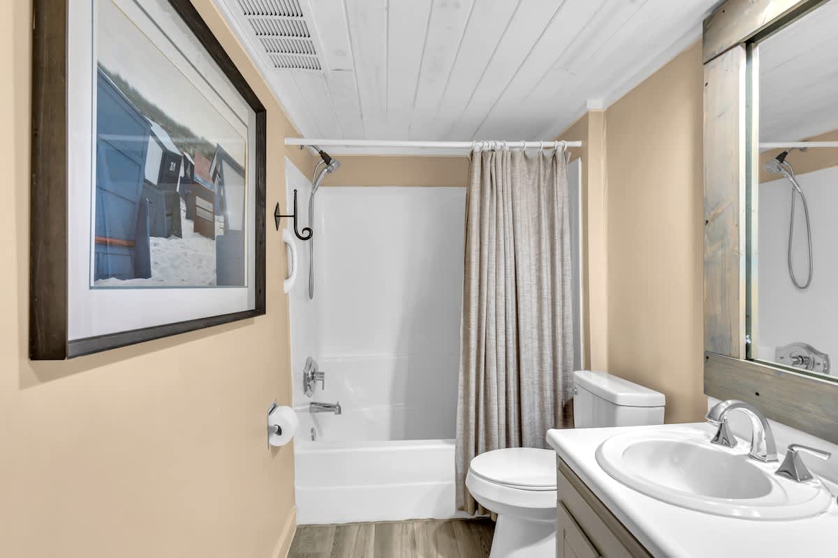 Unwind in your private bathroom featuring a full tub-shower combo, modern fixtures, and thoughtful touches for your comfort.
