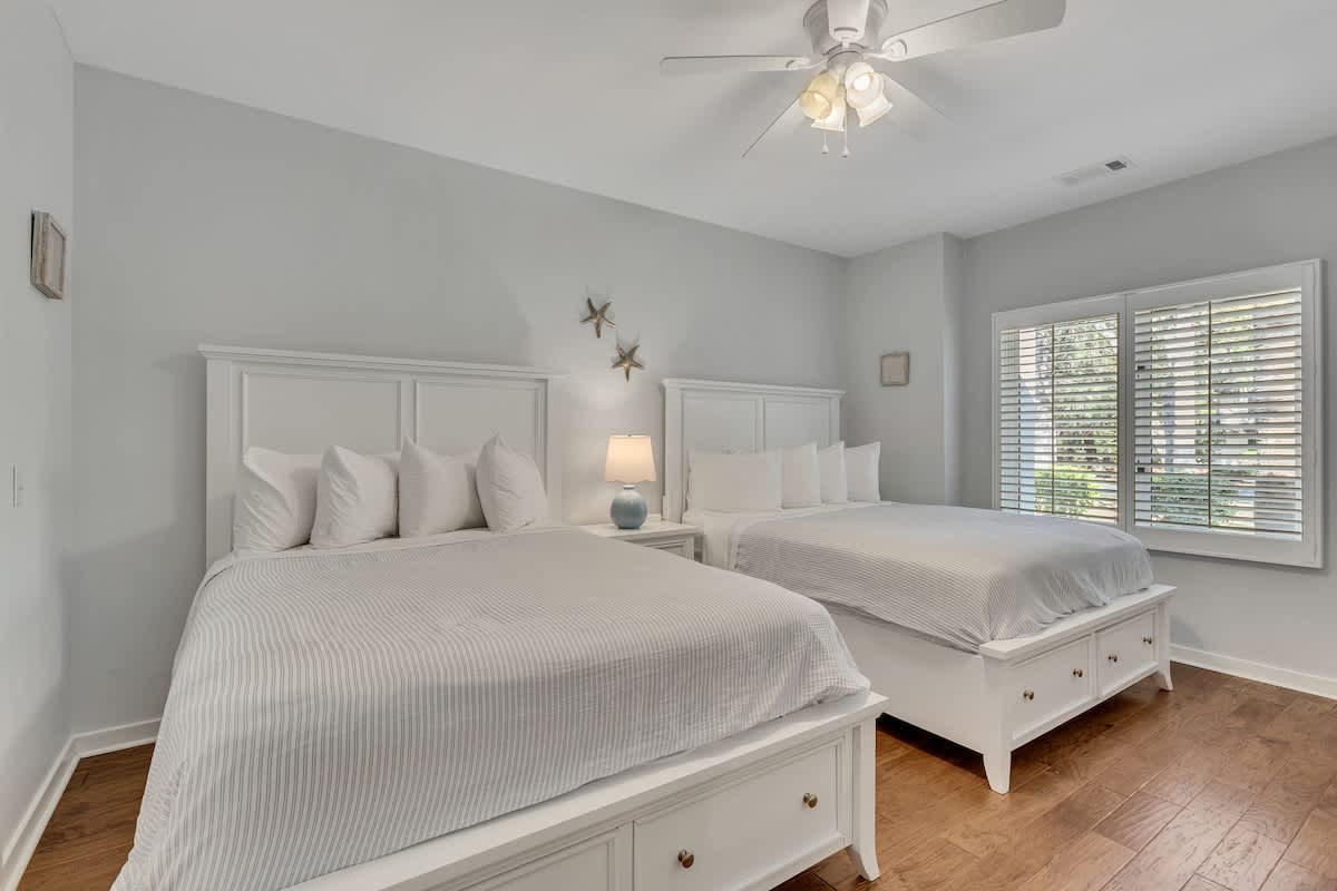 Drift off to sleep in these comfortable double beds with crisp linens and gentle ceiling fan breeze.