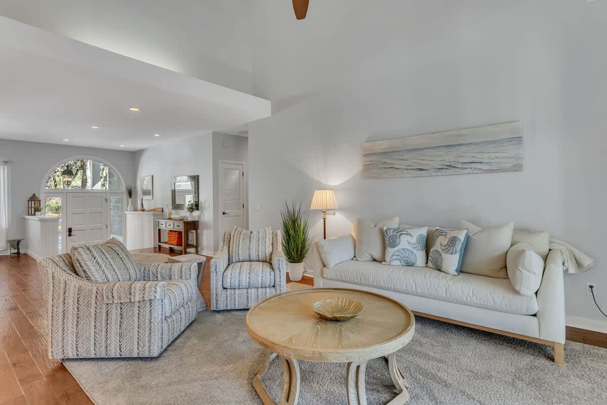 Sink into plush coastal sofas in this bright living room, where ocean-inspired decor and natural light create your perfect retreat.
