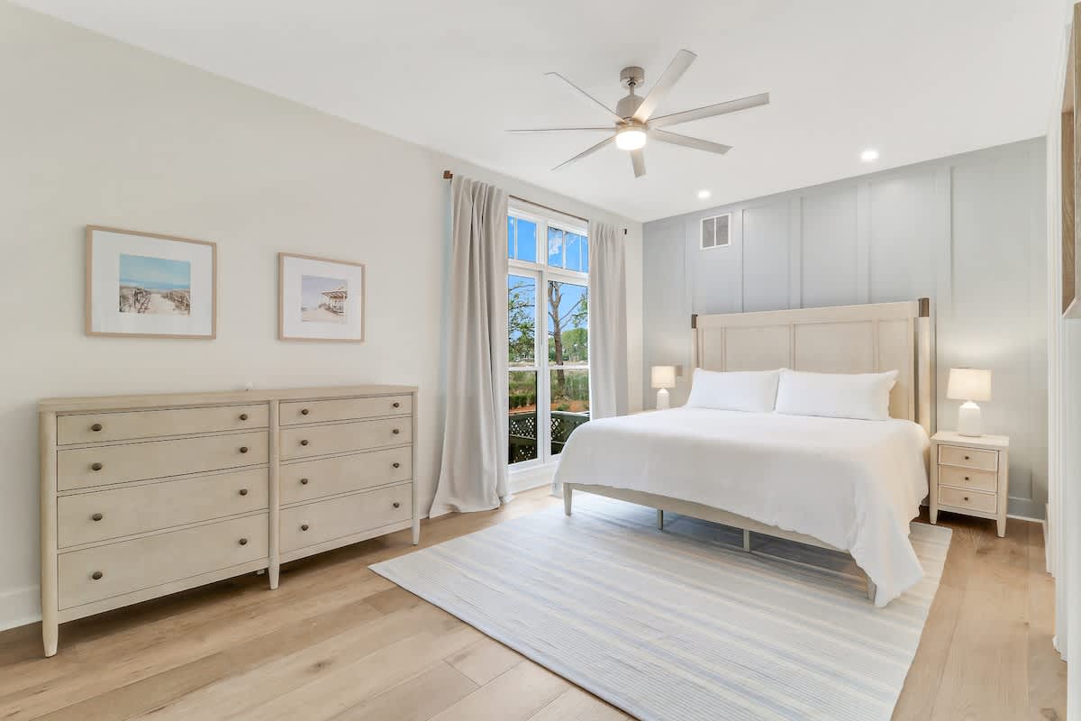 Unwind in your serene coastal-themed bedroom, where soft linens and gentle breezes from your private balcony create the perfect sanctuary.