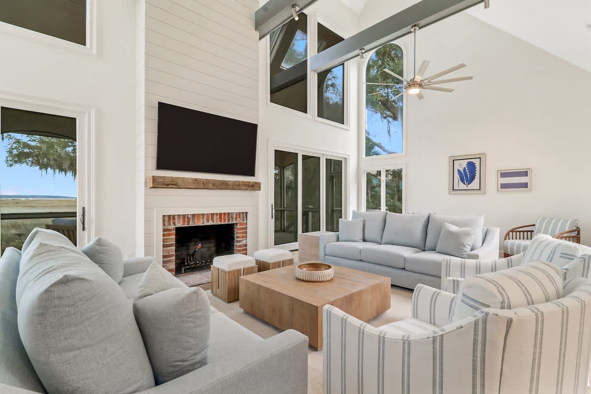 Unwind in your elegant living space featuring soaring ceilings, cozy fireplace, and stylish furnishings that invite relaxation after your adventures.