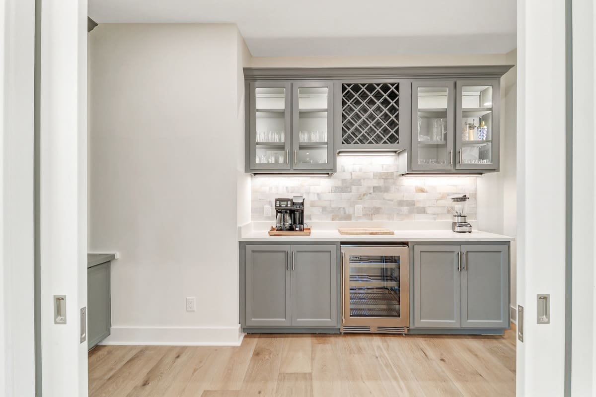 Your elegant butler's pantry features marble counters, wine storage, and coffee station—perfect for entertaining.