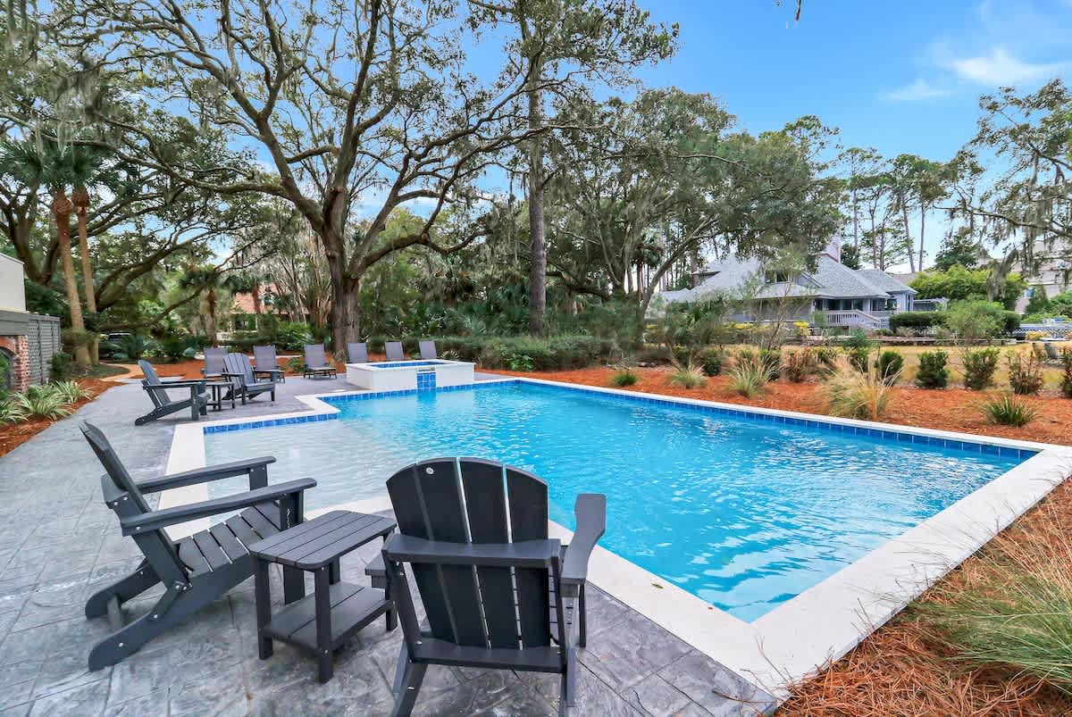 Jump into your private oasis surrounded by lush landscaping and comfortable poolside loungers for ultimate relaxation.