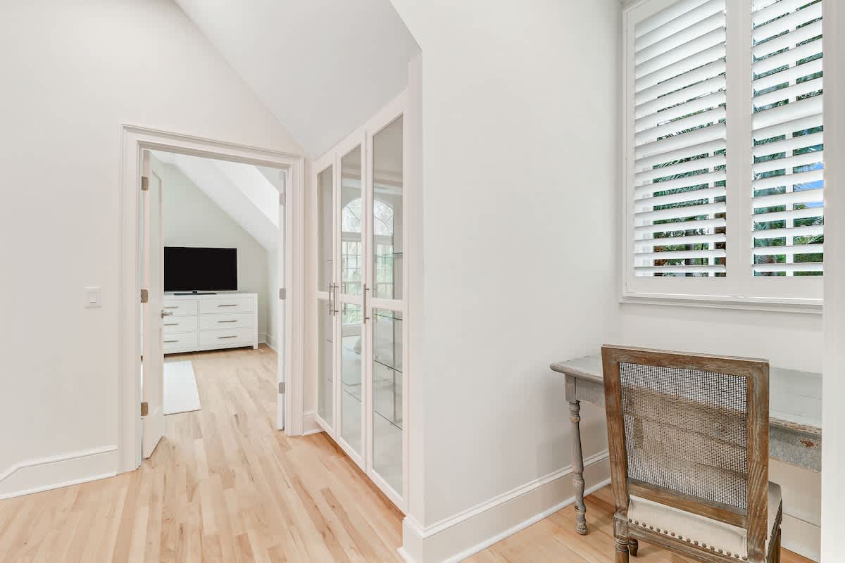 Step into your bright, airy retreat where hardwood floors and white shutters create the perfect blend of comfort and style.