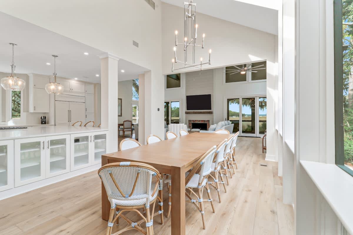 Gather around this stunning dining table where your group will share memorable meals in bright, modern elegance.