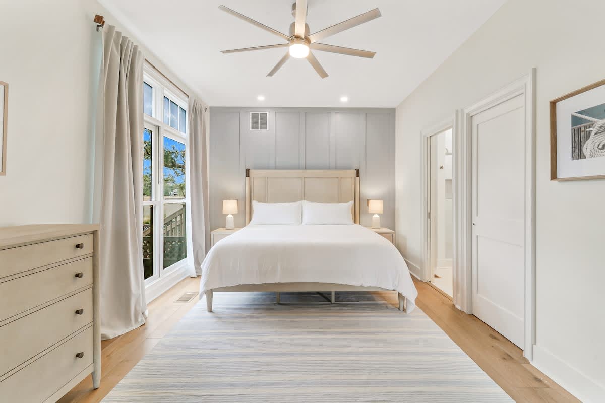 Unwind in your serene bedroom with crisp linens, warm lighting, and peaceful views—your perfect retreat awaits.