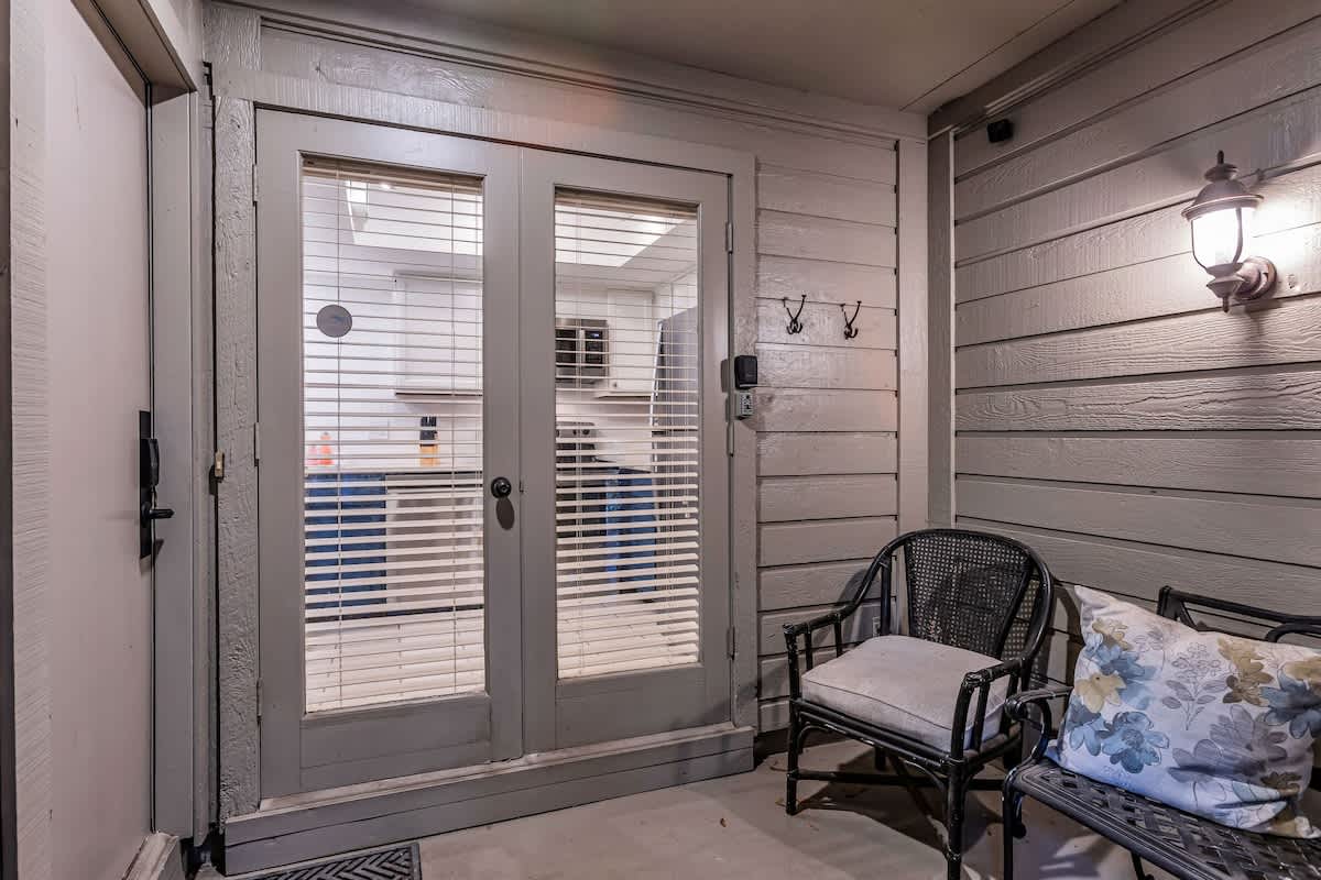 Step onto your private balcony with cozy seating where you can unwind with morning coffee or evening relaxation.