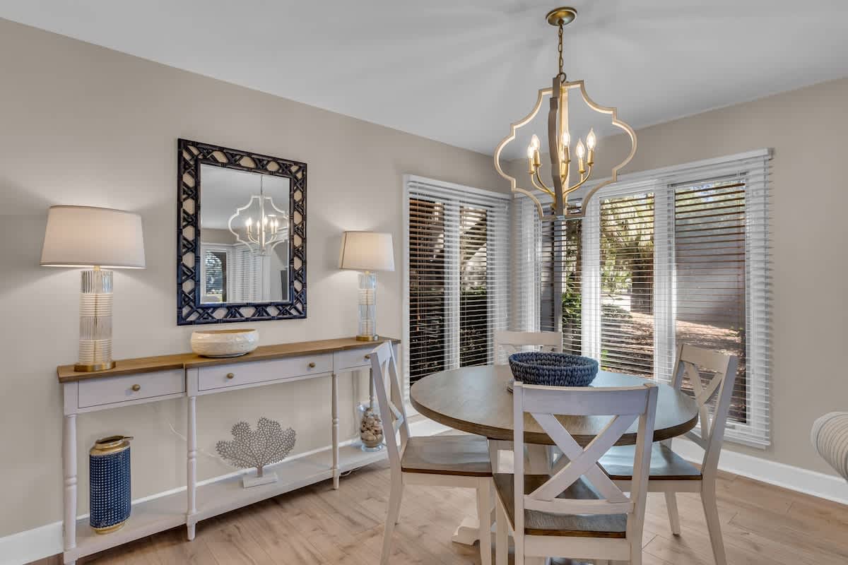 Your elegant dining space features warm wood tones and soft lighting, perfect for intimate meals together.