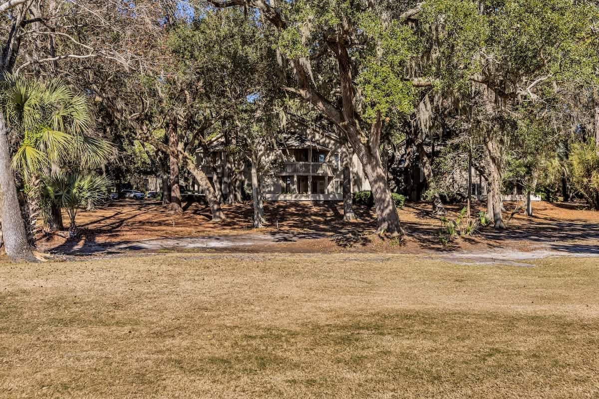 Peaceful property nestled among mature trees and natural landscaping, offering a serene retreat setting.