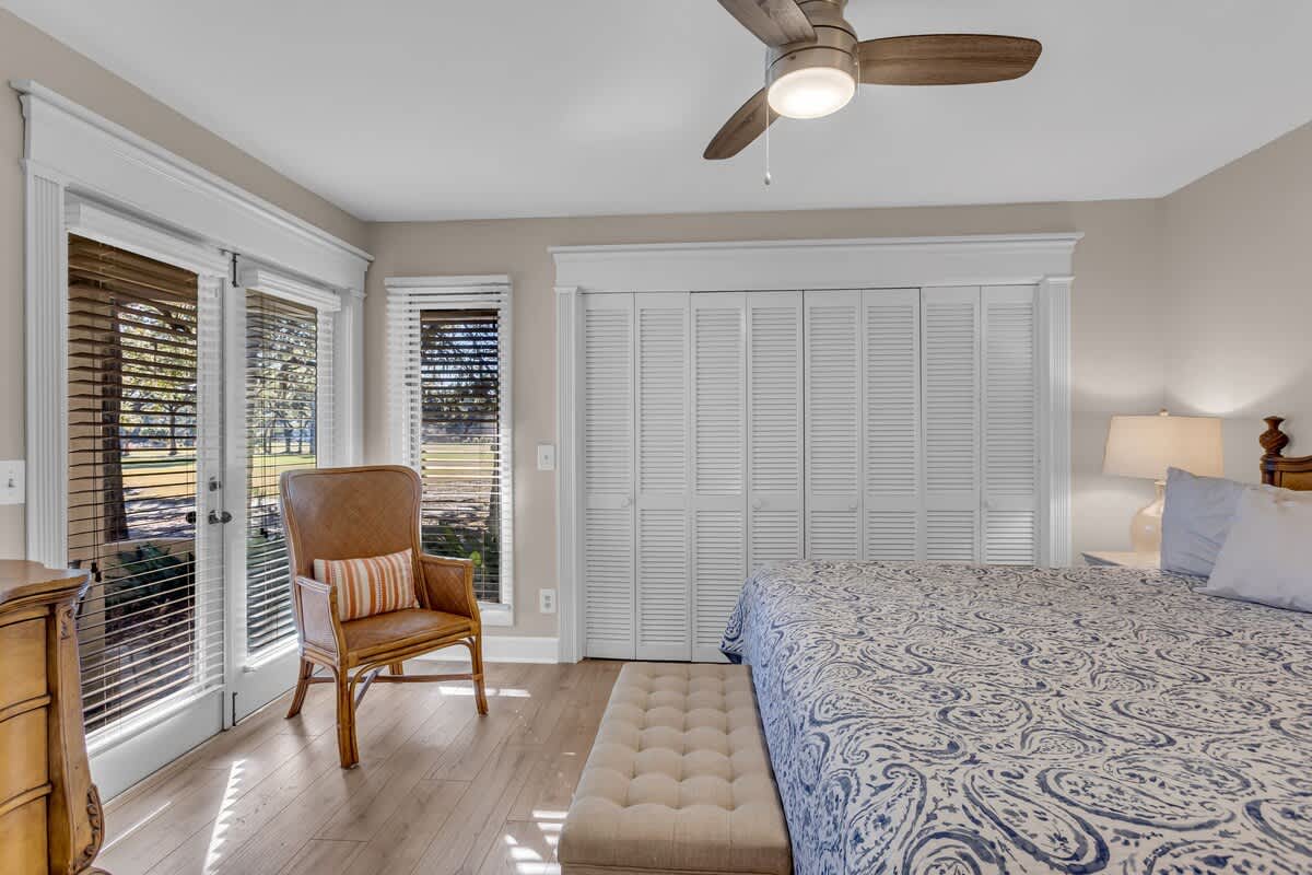 Wake up in your peaceful retreat with crisp linens, natural light streaming through elegant shutters, and your own private balcony.