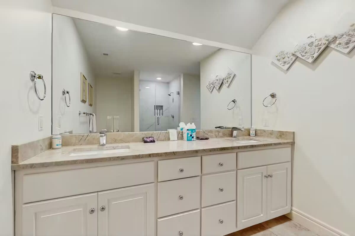 Your spacious bathroom vanity offers dual sinks and ample storage for a comfortable morning routine.