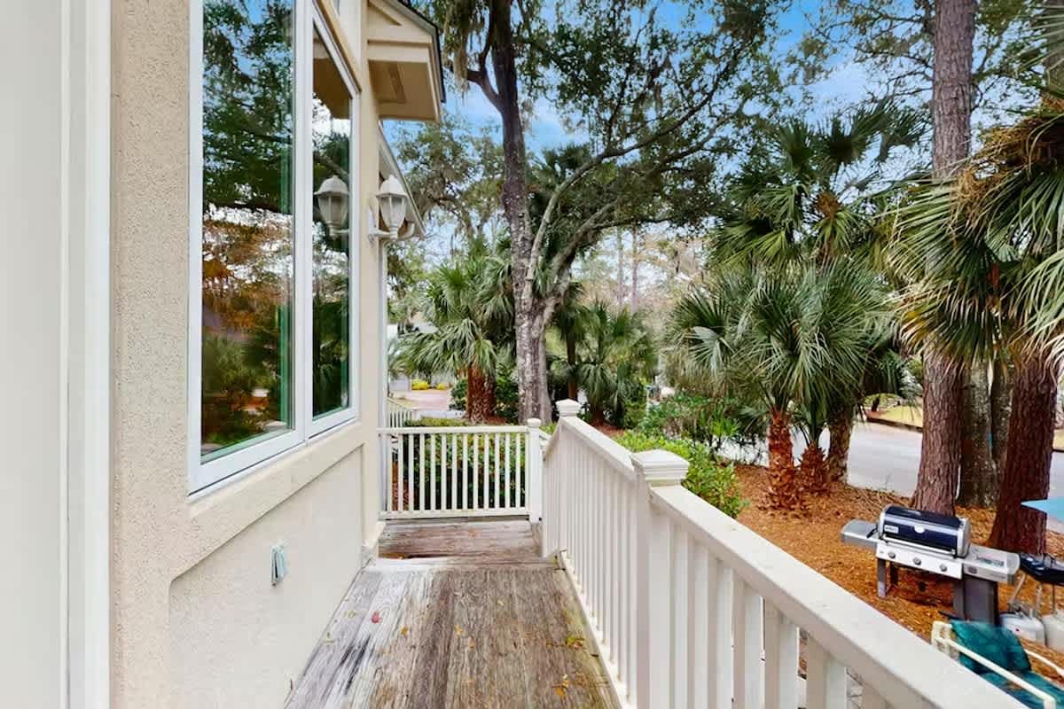 Step onto your private balcony and breathe in the tropical paradise surrounding you, with lush palms swaying gently in the breeze.