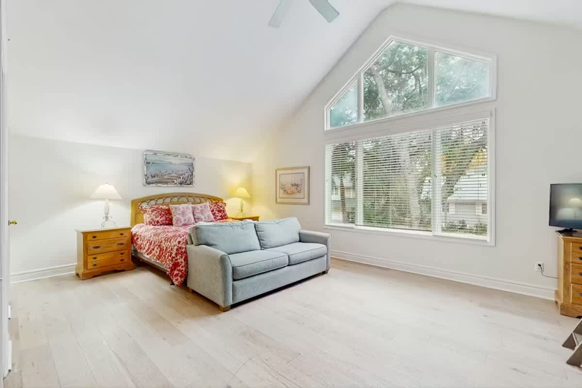 Relax in your bright, airy bedroom with soaring ceilings and peaceful views streaming through generous windows.