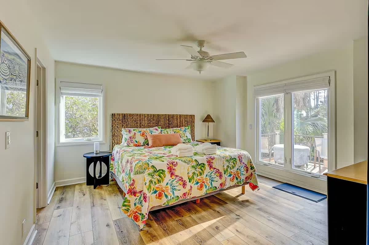 Wake up in your tropical retreat with vibrant florals and gentle breezes from the ceiling fan cooling your mornings.