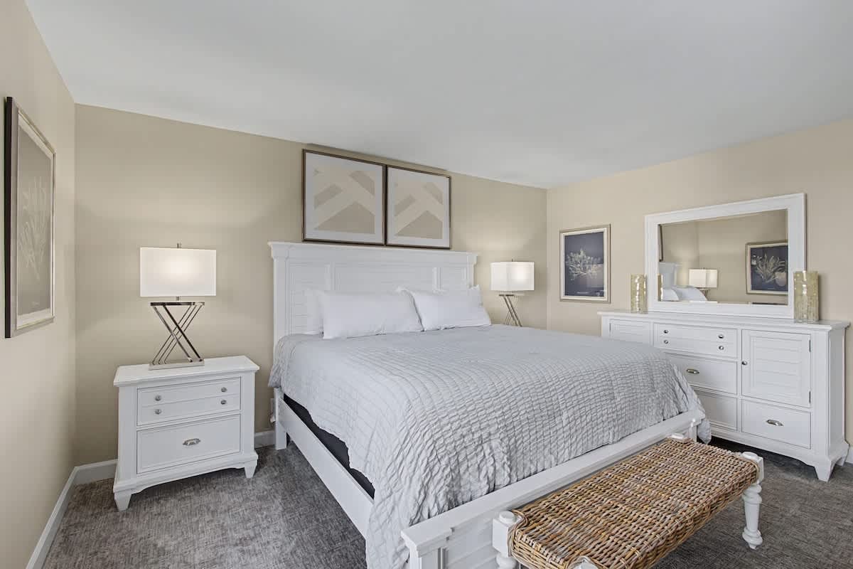 Sink into plush bedding and crisp linens in your serene bedroom retreat, where thoughtful touches create the perfect sanctuary for rest.