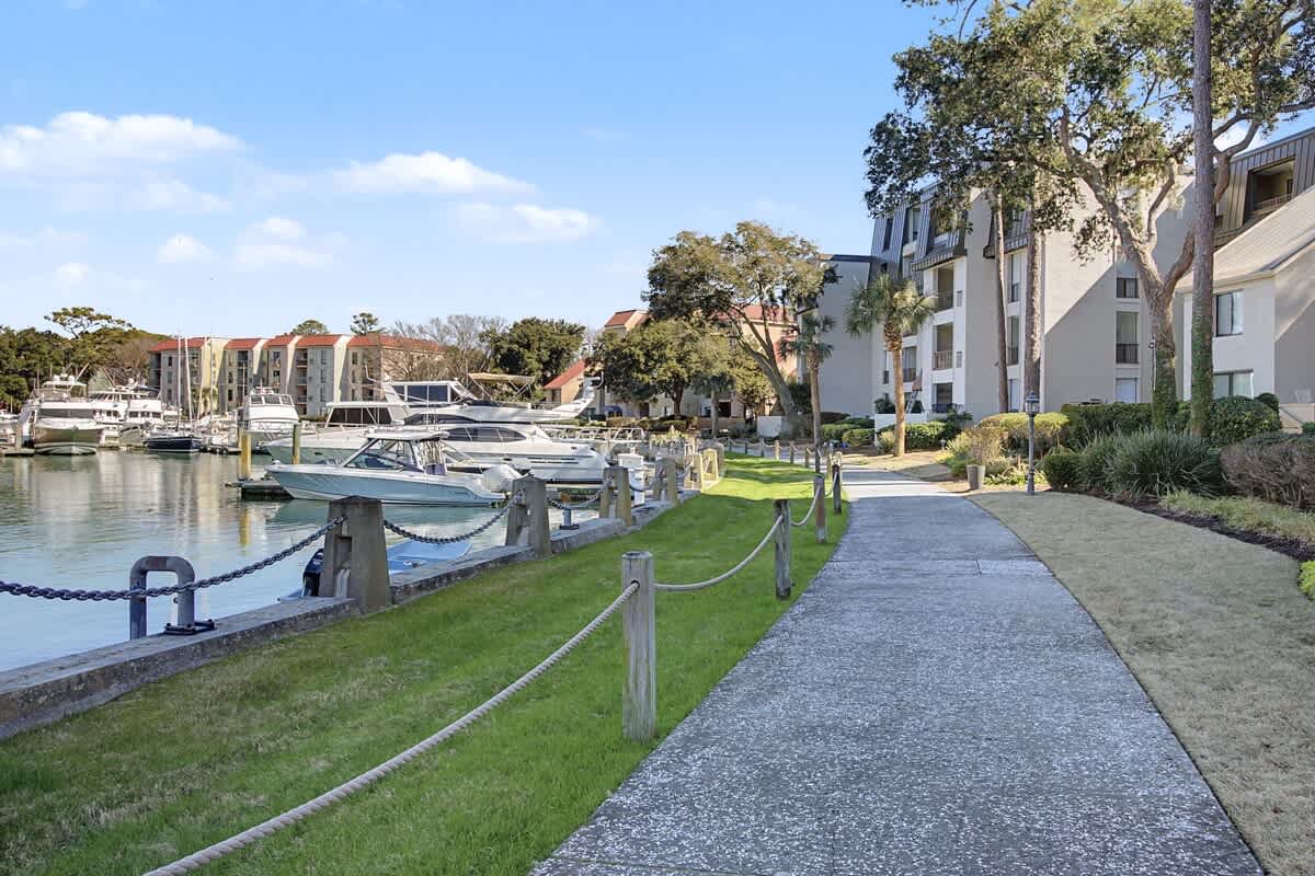 Waterfront property with marina access, landscaped grounds, and scenic walking paths along the harbor.