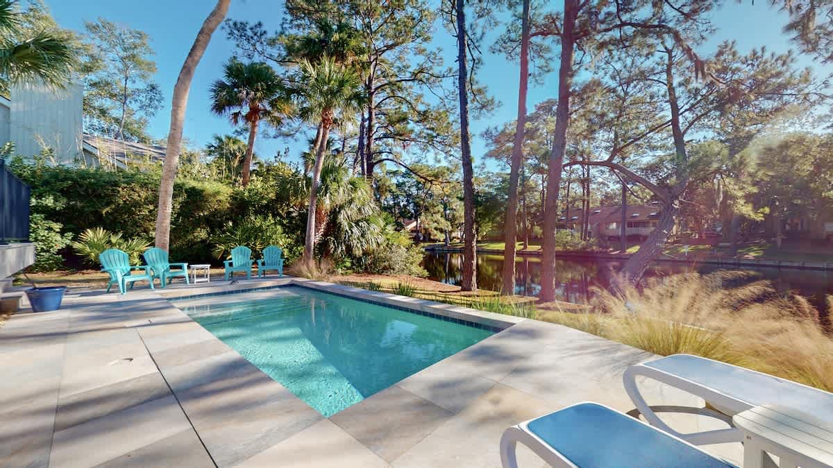 Your private pool oasis awaits, surrounded by swaying palms and lush gardens—perfect for morning swims and afternoon relaxation.
